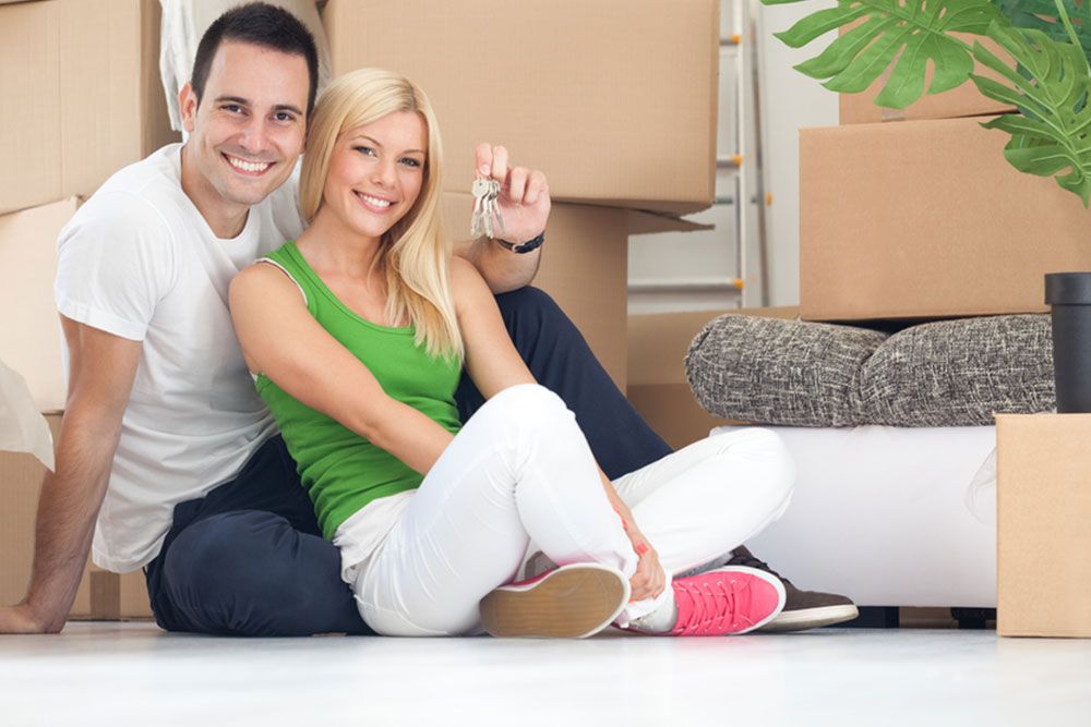 A couple with boxed items from storage facilities